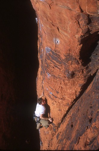 Unknown climber on a 5.10c route in the Black Corridor, Red Rocks, Nev...