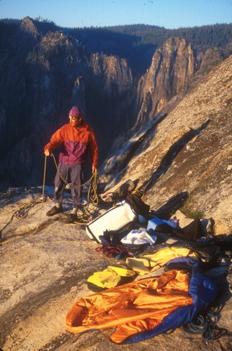 Sean Courage coiling a rope on the summit of the Zodiac, El Capitan. T...