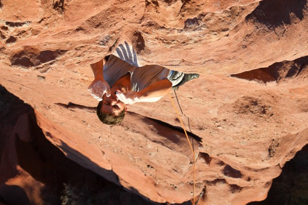 Tom dynoing the crux. 
Entry Fee, Lizard Rock, Fisher Towers, Utah.