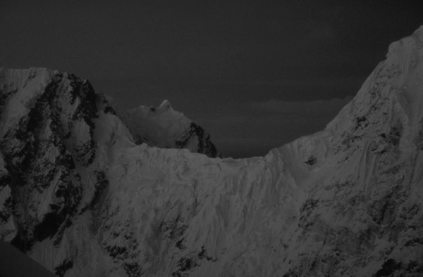 The Rooster Comb and Mt. Huntington at midnight from the summit of Pk ...