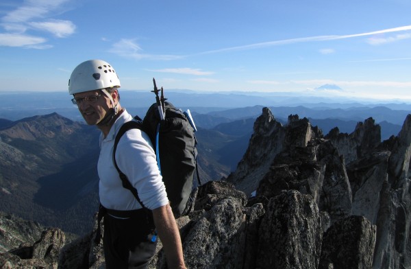 Summit shot of Walt with Mt Rainier in the background