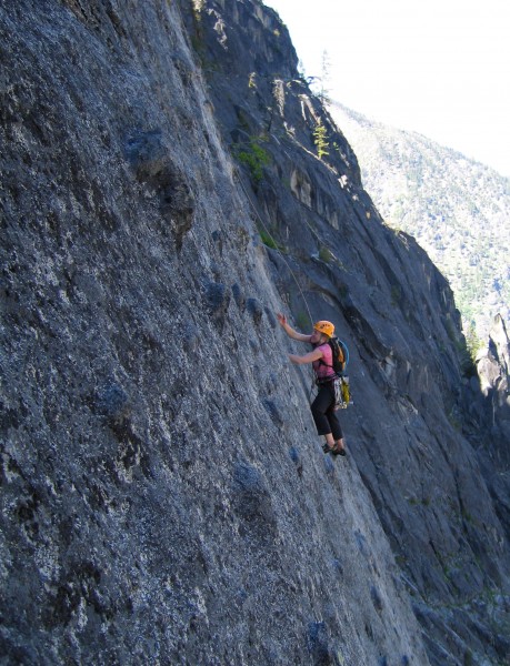Alison finding sinker jams and abundant footholds on the upper headwal...