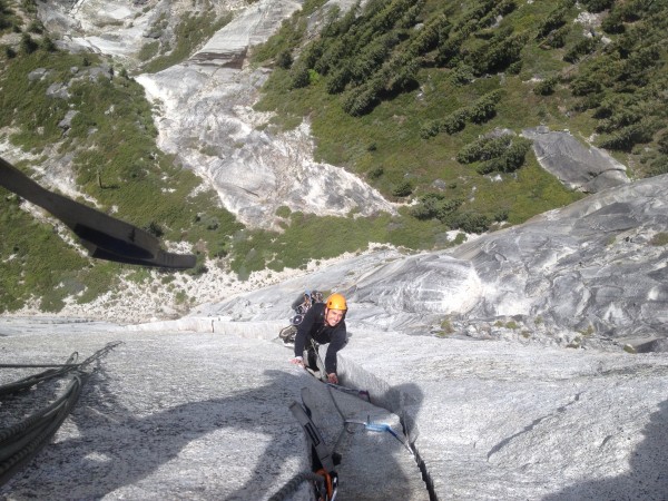 Erik Wright, cracking a smile on the sheer Northwest Face of Half Dome...