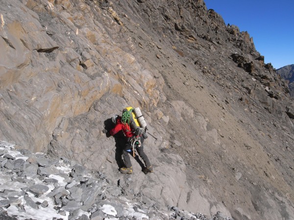 Approach across steep permafrozen dirt slope. Notice the crampons...
