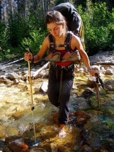 Rebecca Schroeder crossing the frigid Early Winters Creek below the Wi...