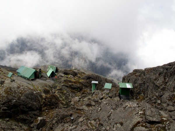Elena huts on Mt. Stanley.  Toilets on the right;  sleep on the left.